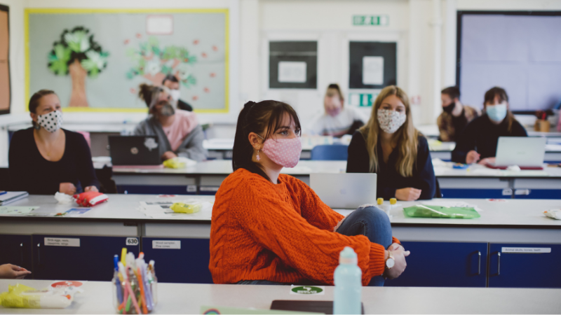 Students wearing face coverings in a classroom